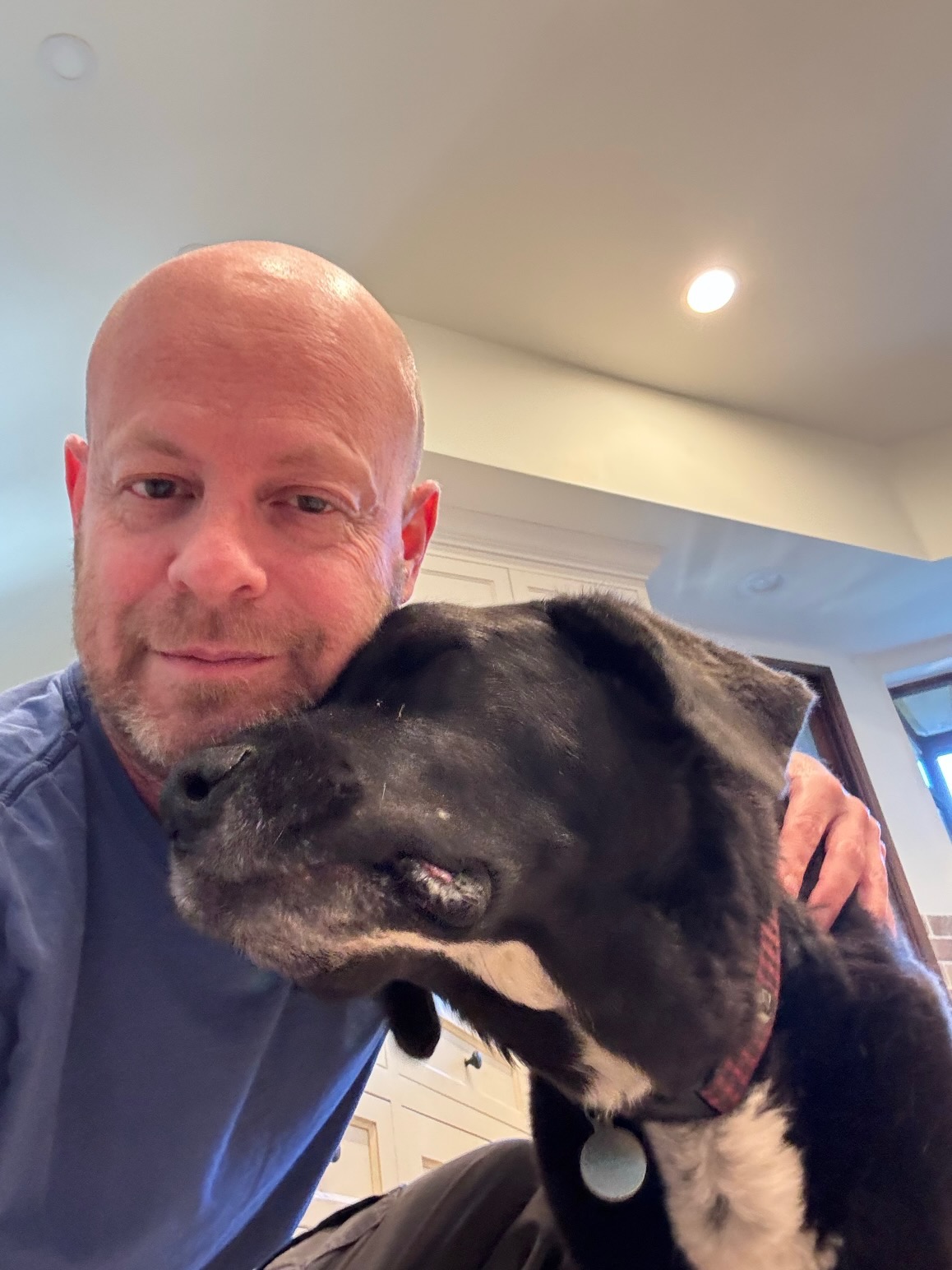 Marc caring for a black dog